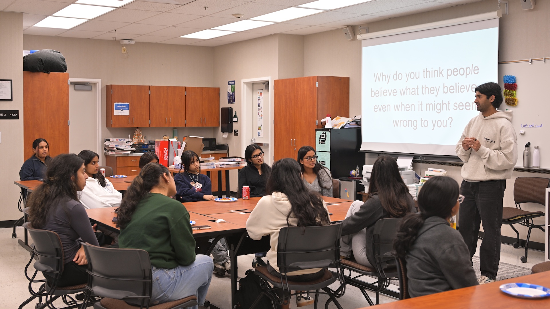 Neel Somani speaking with students