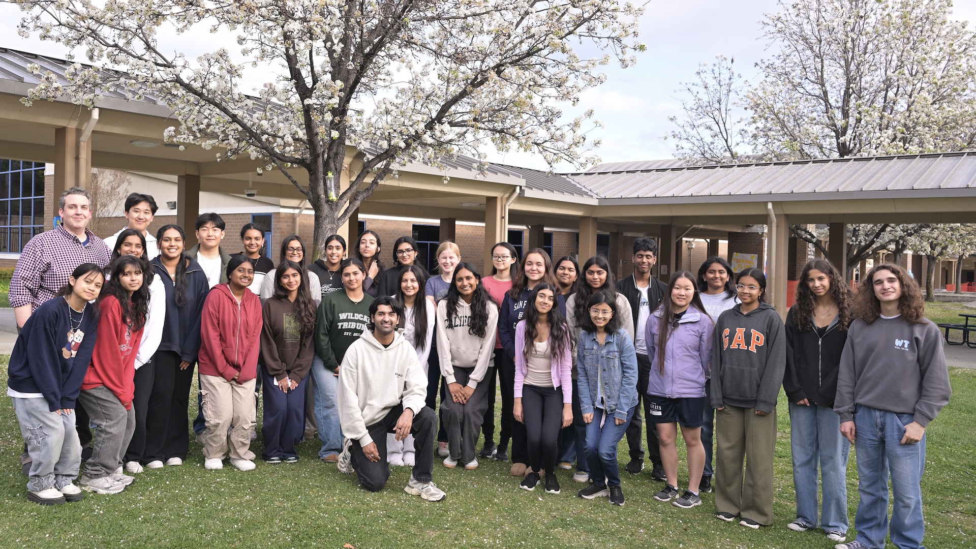 Neel Somani with Wildcat Tribune newspaper students at DVHS high school